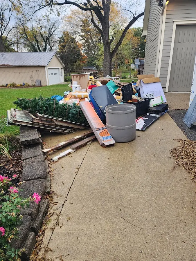 Dumpster being loaded with debris for Demolition Dumpster Rental in Payson